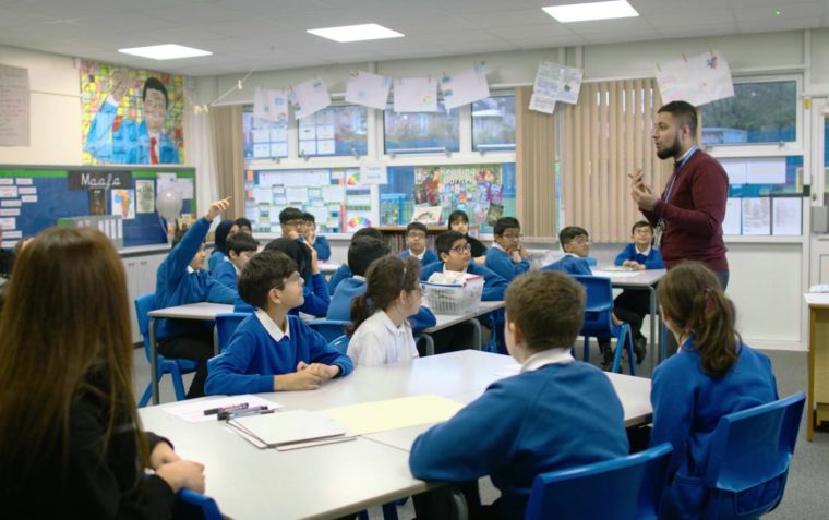 Teacher and students participating in oracy in action
