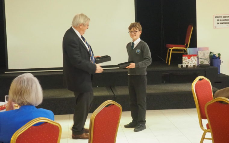 Young pupil being presented with an award