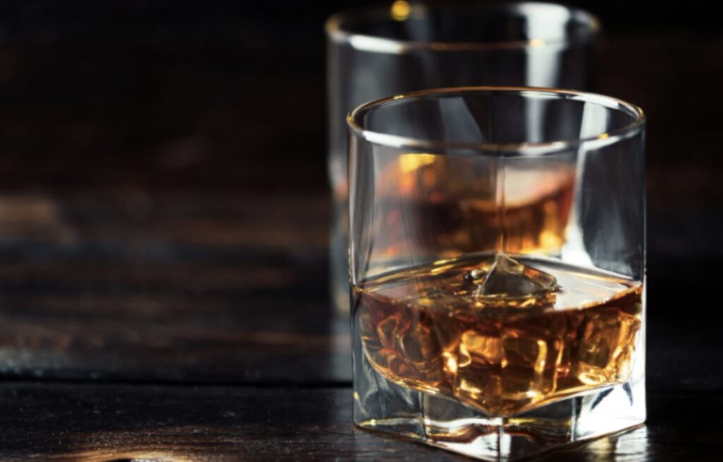 two whisky glasses on a table