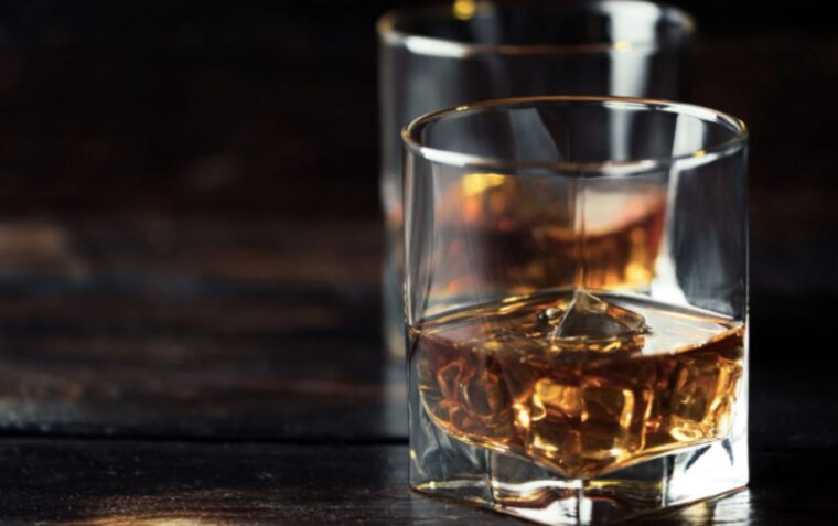 two whisky glasses on a table