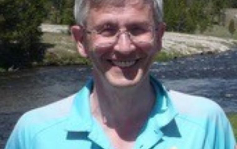 Tim Davies posing for a picture while in nature