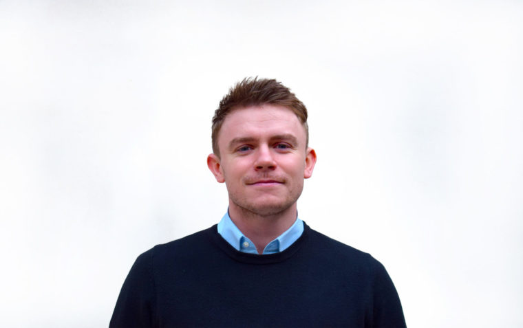 Thomas Kirkham smiling for a photo
